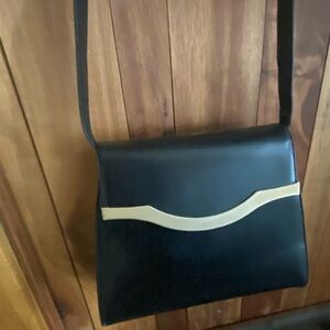 Sleek Black and mat gold Italian leather Crossbody Bag with Minimalist Design